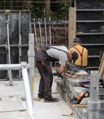 man working at construction site building house